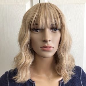 Blonde synthetic wig with bangs. New without tags.
